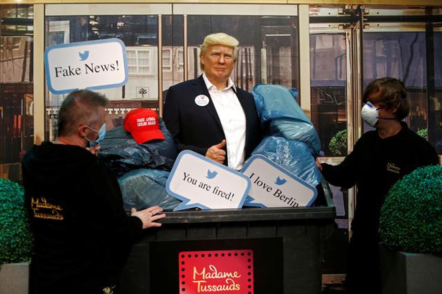 A wax figure depicting US President Donald Trump is put into a dumpster at Madame Tussauds in Berlin, Germany on October 30, 2020 — Reuters photo