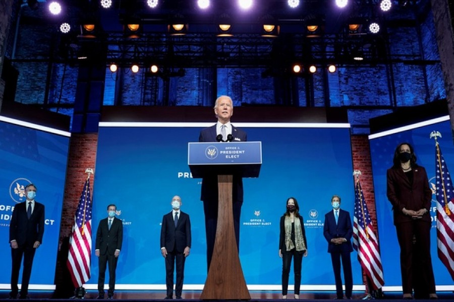 President-elect Joe Biden stands with his nominees for his national security team at his transition headquarters in the Queen Theater in Wilmington, Delaware, US, November 24, 2020. (L-R), are: Antony Blinken to be secretary of state; Jake Sullivan to be US national security adviser; Alejandro Mayorkas to be secretary of Homeland Security; Avril Haines to be director of national intelligence; John Kerry to be a special envoy for climate change; and Ambassador to the United Nations-nominee Linda Thomas-Greenfield, who stands behind Vice President-elect Kamala Haris -- Reuters