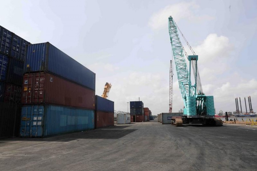 FILE PHOTO: Cranes and containers seen at APM Terminals on the gateway port in Apapa, Lagos, Nigeria July 30, 2019. REUTERS/Temilade Adelaja