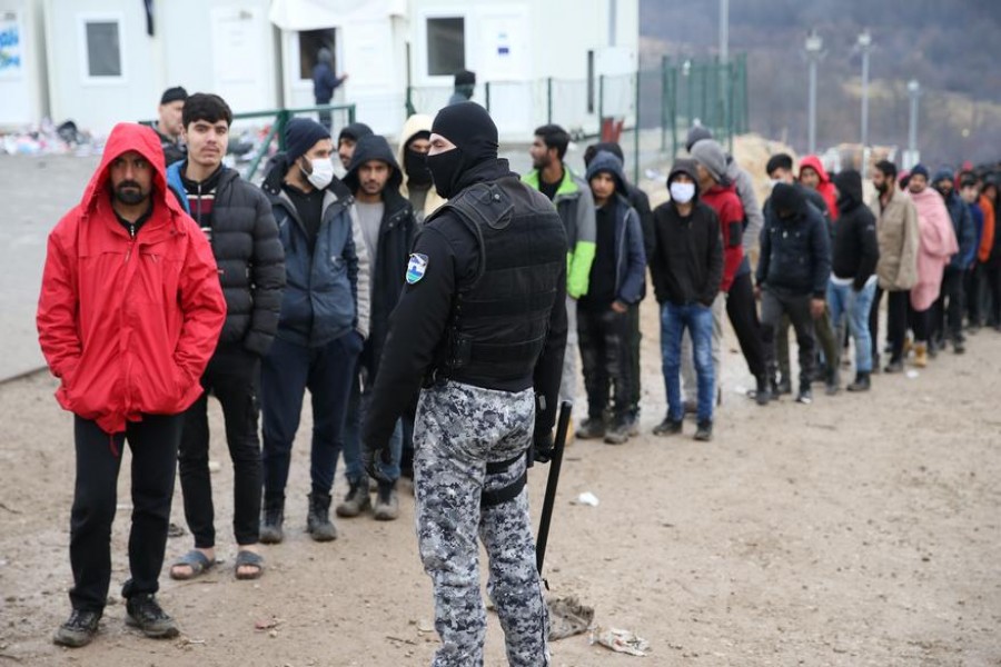 Migrants wait for food in camp "Lipa" in Bihac, Bosnia and Herzegovina January 5, 2021. REUTERS/Dado Ruvic/File Photo