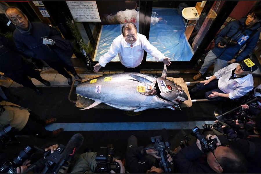 Kiyoshi Kimura, president of Kiyomura Corp., operator of Japanese sushi chain Sushizanmai, poses with a bluefin tuna that was auctioned for 193 million Japanese yen (about $1.8 million) in Tokyo, Japan January 5, 2020. Mandatory credit Kyodo