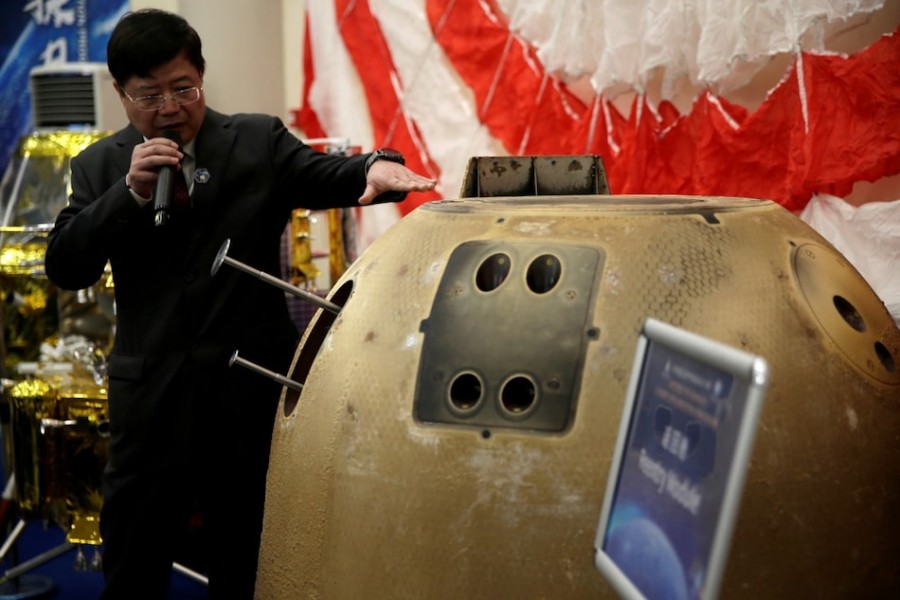 Pei Zhaoyu, spokesperson for Chang’e-5 Mission, introduces the reentry module which carried moon sample — Reuters photo