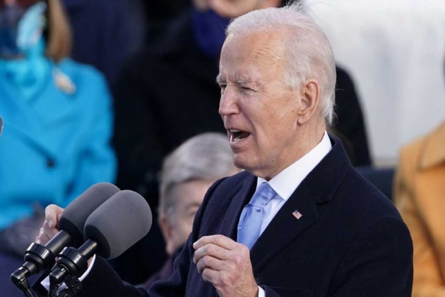 Biden tells divided nation 'democracy has prevailed' after assuming US presidency