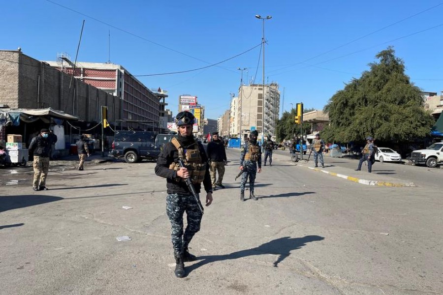 Iraqi security forces keep guard the site of a suicide attack in Baghdad, Iraq January 21, 2021. REUTERS/Thaier al-Sudani