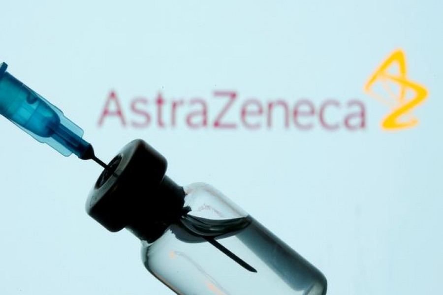 A vial and syringe in front of an AstraZeneca logo in this illustration taken January 11, 2021 — Reuters/Files