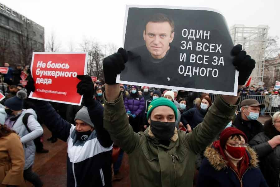 A participant holding a placard reading "One for all, all for one" during a rally in support of jailed Russian opposition leader Alexei Navalny in Moscow on Saturday –Reuters Photo