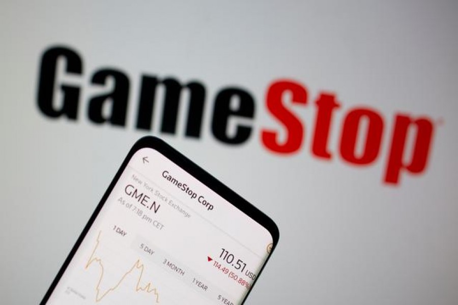 FILE PHOTO: GameStop stock graph is seen in front of the company's logo in this illustration taken February 2, 2021. REUTERS/Dado Ruvic/Illustration/File Photo