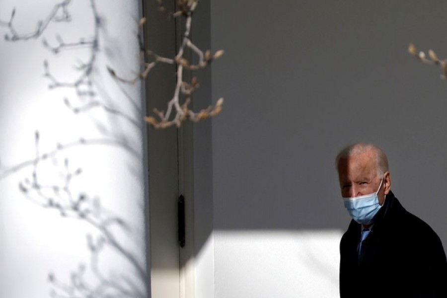 US President Joe Biden walks into the Oval Office in Washington, US, February 8, 2021. Reuters