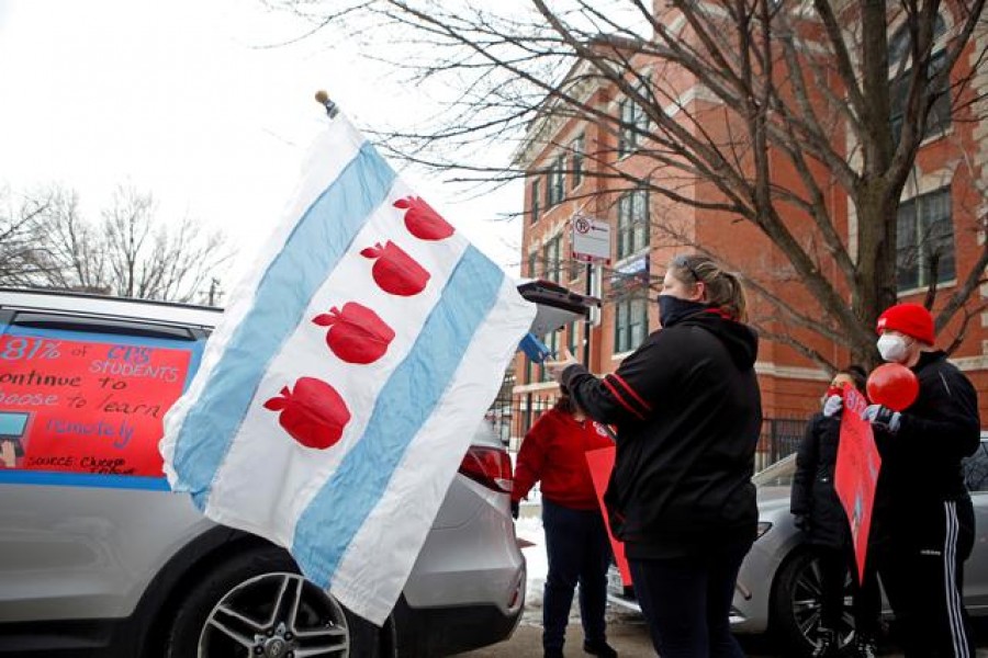 Supporters of the Chicago Teachers Union prepare for a car caravan, as negotiations with Chicago Public Schools continue over a coronavirus disease (COVID-19) safety plan agreement in Chicago, Illinois, US, January 30, 2021. REUTERS/Eileen T. Meslar/File Photo/File Photo