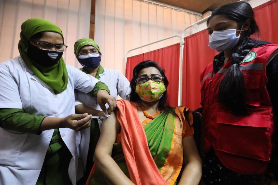 A woman receives the Covid-19 vaccine in Dhaka on February 7. 	—Xinhua Photo