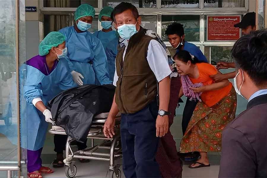 Medical personnel carry the body of the young woman protester Mya Thwate Thwate Khaing, 20, who was shot in the head last week as police tried to disperse a crowd, after she died in a hospital in Naypyitaw of Myanmar on Friday -Reuters Photo