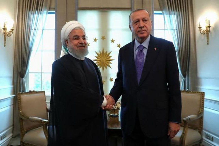 FILE PHOTO: Turkish President Tayyip Erdogan meets with his Iranian counterpart Hassan Rouhani in Ankara, Turkey, September 16, 2019. Erdem Sahin/Pool via REUTERS