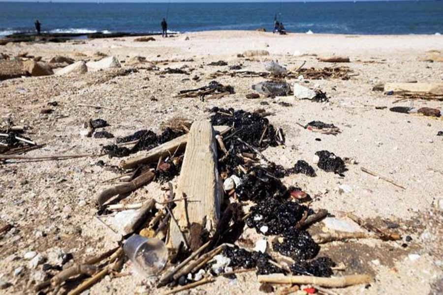 Israel's beaches blackened after offshore oil spill