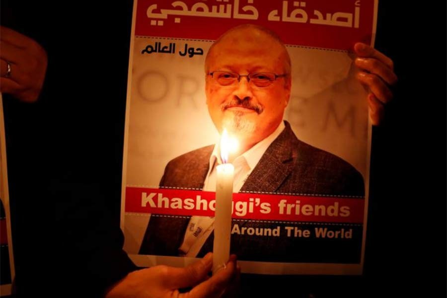 A demonstrator holds a poster with a picture of Saudi journalist Jamal Khashoggi outside the Saudi Arabia consulate in Istanbul in 2018 -Reuters file photo