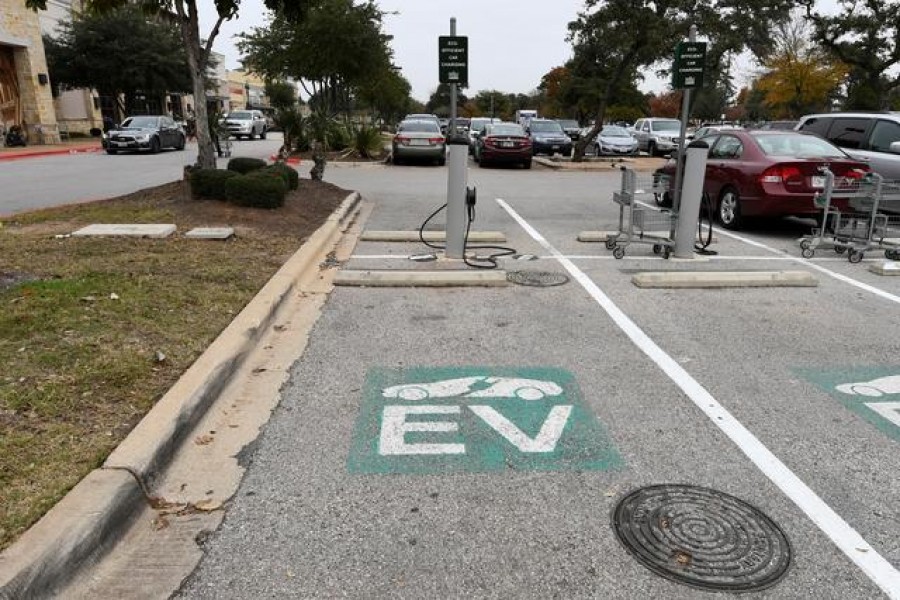 An electric vehicle (EV) fast charging station is seen in the parking lot of a Whole Foods Market in Austin, Texas, US, December 14, 2016. REUTERS/Mohammad Khursheed