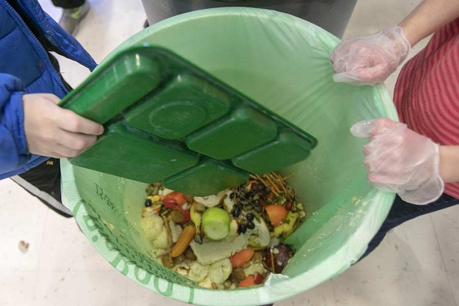 Students discard food at the end of their lunch period as part of a lunch waste composting programme at an elementary school in the United States last year –AP file photo