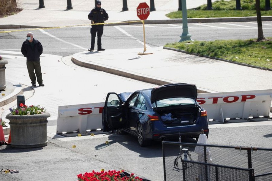 A blue car is seen after ramming a police barricade outside the US Capitol building in an incident that reportedly resulted in the death of one Capitol police officer, the injury of another officer and the death of the driver as a result of police gunfire on Capitol Hill in Washington, US, April 2, 2021. REUTERS/Tom Brenner