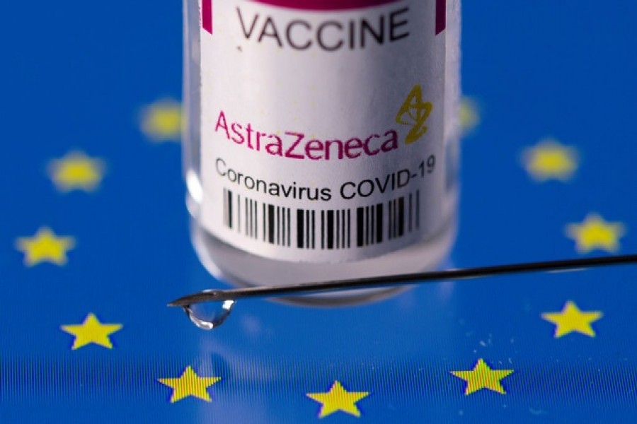 Vial labelled "AstraZeneca coronavirus disease (COVID-19) vaccine" placed on displayed EU flag is seen in this illustration picture taken March 24, 2021. Reuters