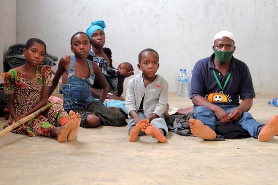 Adelino Alberto and his family who fled an attack claimed by Islamic State-linked insurgents on the town of Palma, are seen at a temporary displacement centre in Pemba, Mozambique, April 3, 2021. Picture taken April 03, 2021. REUTERS/Emidio Jozine