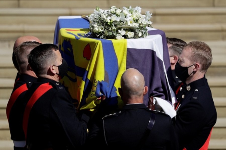 The coffin of Britain's Prince Philip, husband of Queen Elizabeth, who died at the age of 99, is taken into St George's Chapel for a funeral service, in Windsor, Britain, Apr 17, 2021. REUTERS