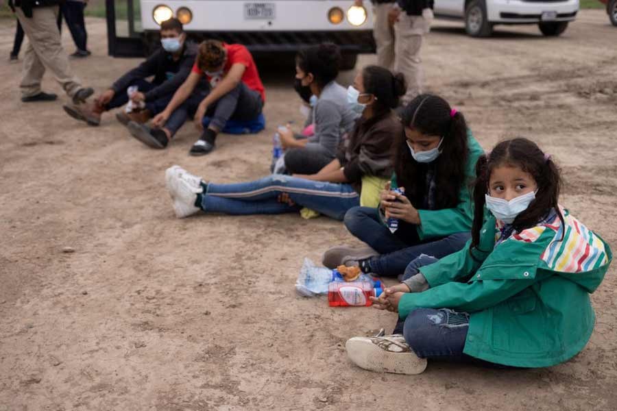 Chanel, 7, and her sister Adriana, 10, both unaccompanied minors travelling alone from Honduras, sits among other asylum-seeking children on May 6 as they wait to be transported to a US border patrol processing facility after crossing the Rio Grande river into the United States from Mexico. –Reuters file photo