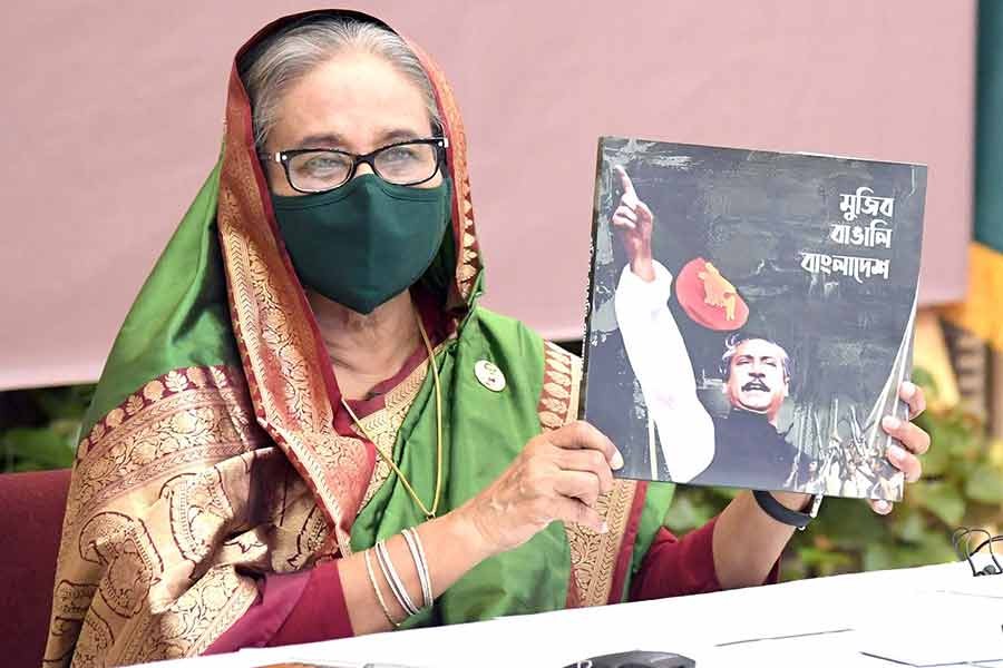 Prime Minister Sheikh Hasina unveiling the cover of a memorial publication, titled Mujib Bangalee Bangladesh, at a function on Tuesday marking 35th founding anniversary of the Special Security Force (SSF) -PID Photo