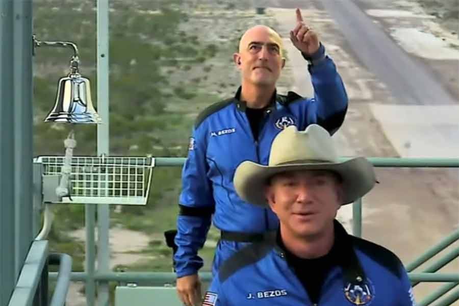 Billionaire Jeff Bezos, founder of ecommerce company Amazon.com Inc, and his brother Mark board ahead of their scheduled flight aboard Blue Origin's New Shepard rocket near Van Horn in Texas of the United States on Tuesday. The still image was captured from a video.  -Reuters Photo
