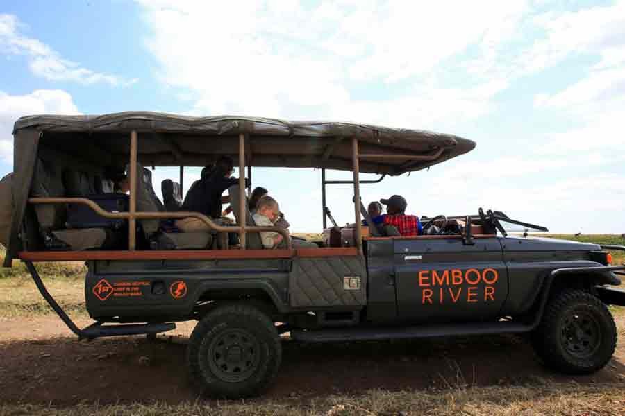 Gladys Kisemei, a tour guide at the Emboo River Camp, driving tourists from the Ol Kiombo airstrip using an electric-powered safari vehicle at the Maasai Mara National Reserve in Narok County of Kenya on July 16 this year -Reuters file photo