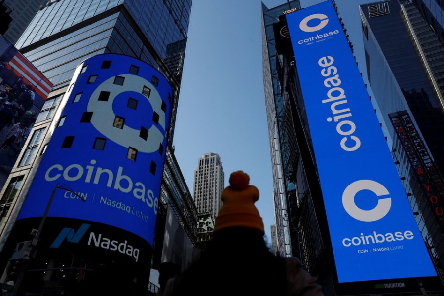 The logo for Coinbase Global Inc, the biggest US cryptocurrency exchange, is displayed on the Nasdaq MarketSite jumbotron and others at Times Square in New York, US, April 14, 2021. REUTERS/Shannon Stapleton/File Photo