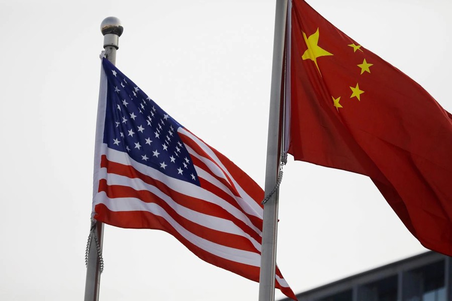 Chinese and US flags flutter outside the building of an American company in Beijing, China on January 21, 2021 — Reuters/Files