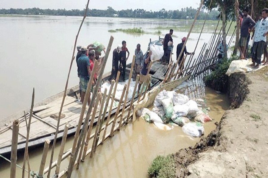 Villagers try to protect rural road from erosion