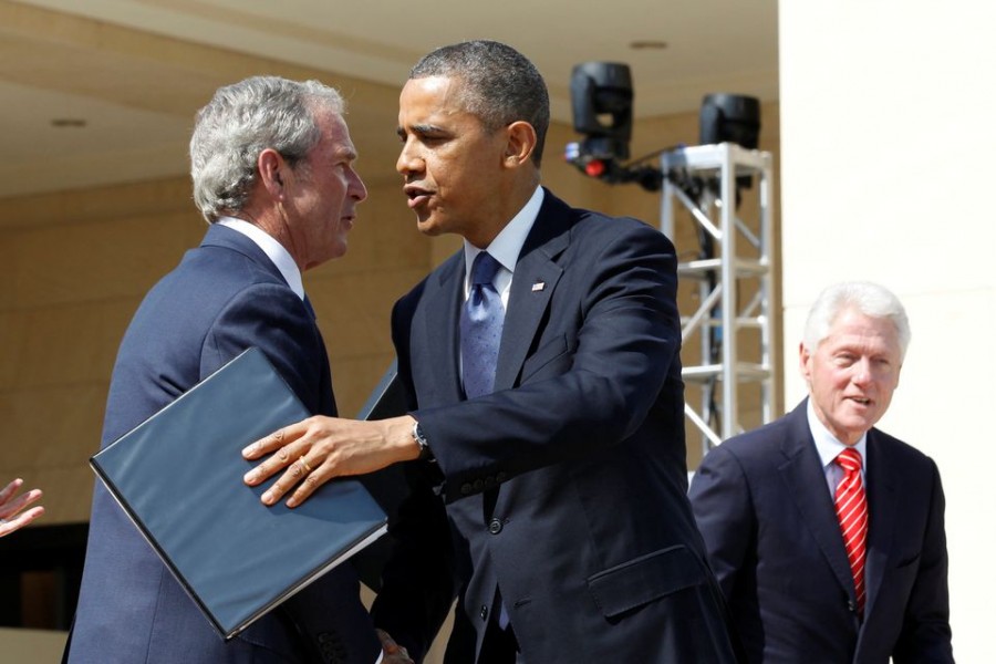 US President Barack Obama embraces former President George W Bush following remarks at the dedication ceremony of the George W Bush Presidential Centre in Dallas, April 25, 2013. Former president Bill Clinton is pictured at right — Reuters/Files