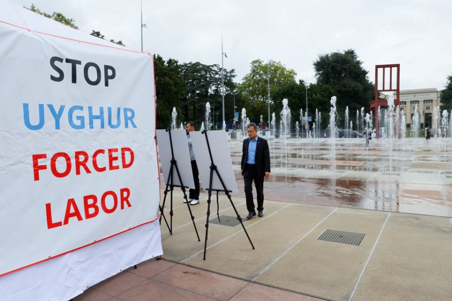 Dolkun Isa, President of the World Uyghur Congress, poses at a United States-backed Uyghur photo exhibit of dozens of people who are missing or alleged to be held in Chinese-run camps in Xinjiang, China in front of the United Nations in Geneva, Switzerland, September 16, 2021 — Reuters