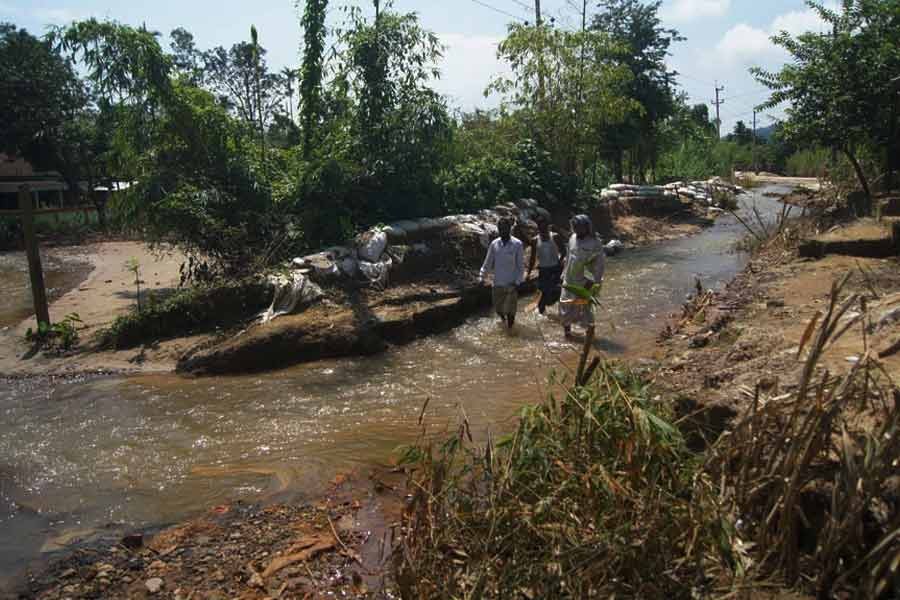Water passing through ditches developed on Tahirpur-Tekerghat road in Sunamganj by rolling waters from Meghalaya hills —FE file photo