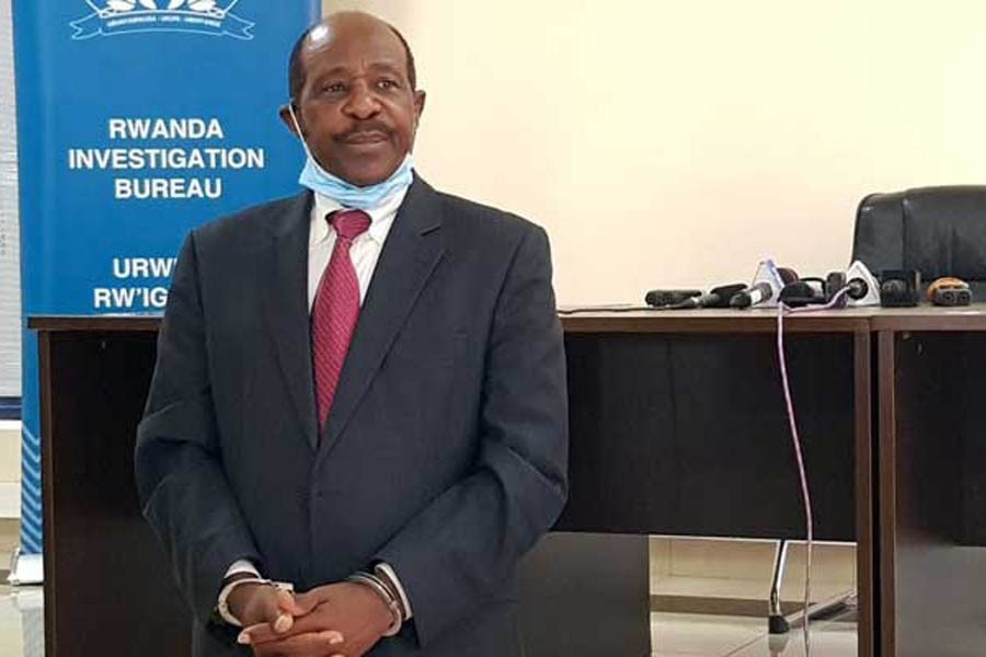 Paul Rusesabagina, the man who was hailed a hero in a Hollywood movie about the country's 1994 genocide is detained and paraded in front of media in handcuffs at the headquarters of Rwanda Investigation Bureau in Kigali, Rwanda August 31, 2020. REUTERS/Clement Uwiringiyimana