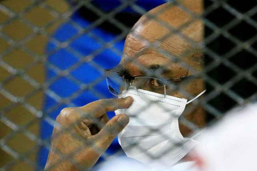Sudan's ousted President Omar al-Bashir is seen inside the defendant's cage during his and some of his former allies trial over the 1989 military coup that brought the autocrat to power in 1989, at a courthouse in Khartoum, Sudan on September 15 last year –Reuters file photo