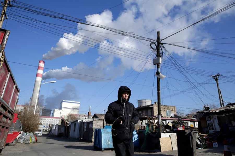 A man walks near a coal-fired power plant in Harbin, Heilongjiang province, China, November 27, 2019.      --REUTERS Photo
