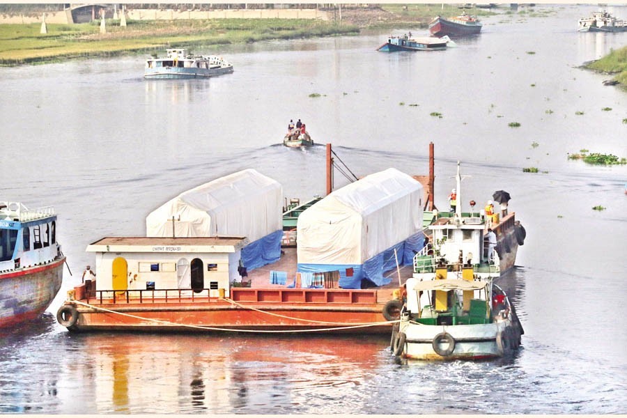 A barge sailing down the Turag river after crossing Birulia area on the outskirts of Dhaka few months ago —FE file photo