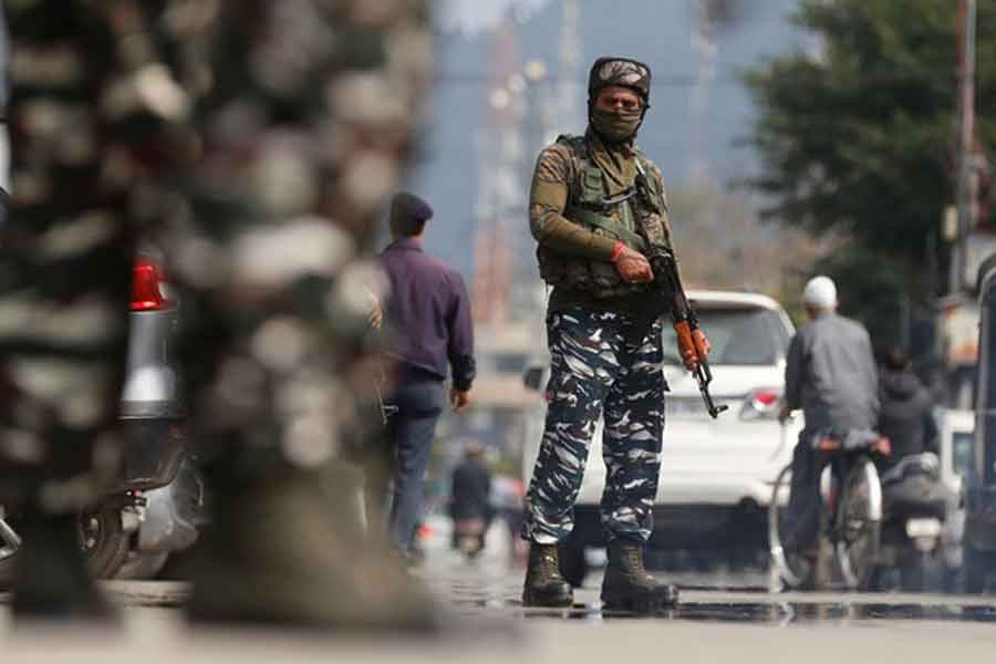 Indian Central Reserve Police Force (CRPF) personnel standing guard on a street in Srinagar on October 12 this year –Reuters file photo