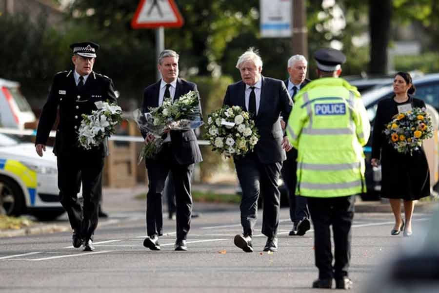 Chief Constable of Essex Police B. J. Harrington, Britain's Labour Party leader Keir Starmer, Prime Minister Boris Johnson, Speaker of the House Sir Lindsay Hoyle and Home Secretary Priti Patel hold flowers as they arrive at the scene where British MP David Amess was stabbed to death during a meeting with constituents at the Belfairs Methodist Church, in Leigh-on-Sea, Britain, on Saturday. –Reuters file photo