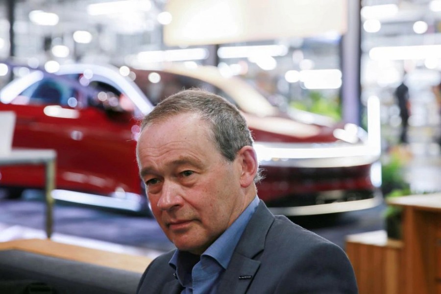 Lucid CEO Peter Rawlinson speaks with a reporter at the Lucid Motors plant in Casa Grande, Arizona, US on September 28, 2021 — Reuters/Files