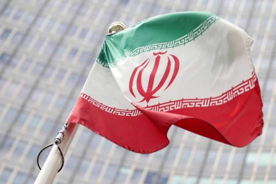The Iranian flag waves in front of the International Atomic Energy Agency (IAEA) headquarters in Vienna, Austria May 23, 2021 -- Reuters/Files