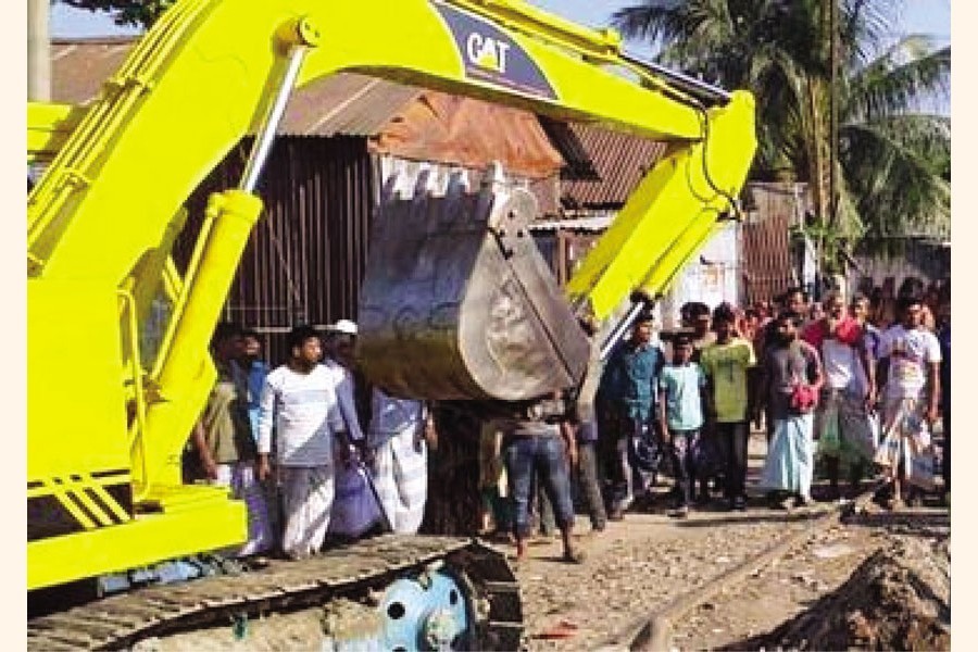 Illegal structures demolished in the railway Koila Ghat area in Chandpur — FE Photo