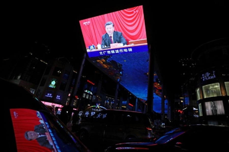 A giant screen shows Chinese President Xi Jinping attending the sixth plenary session of the 19th Central Committee of the Communist Party of China (CPC), in Beijing, China Nov 11, 2021. REUTERS/Tingshu Wang