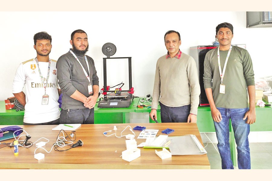 The writer (third from right) and his team at Fabrication Laboratory at Daffodil International University with supervisor Dr Sheak Rashed Haider Noori (second from right)