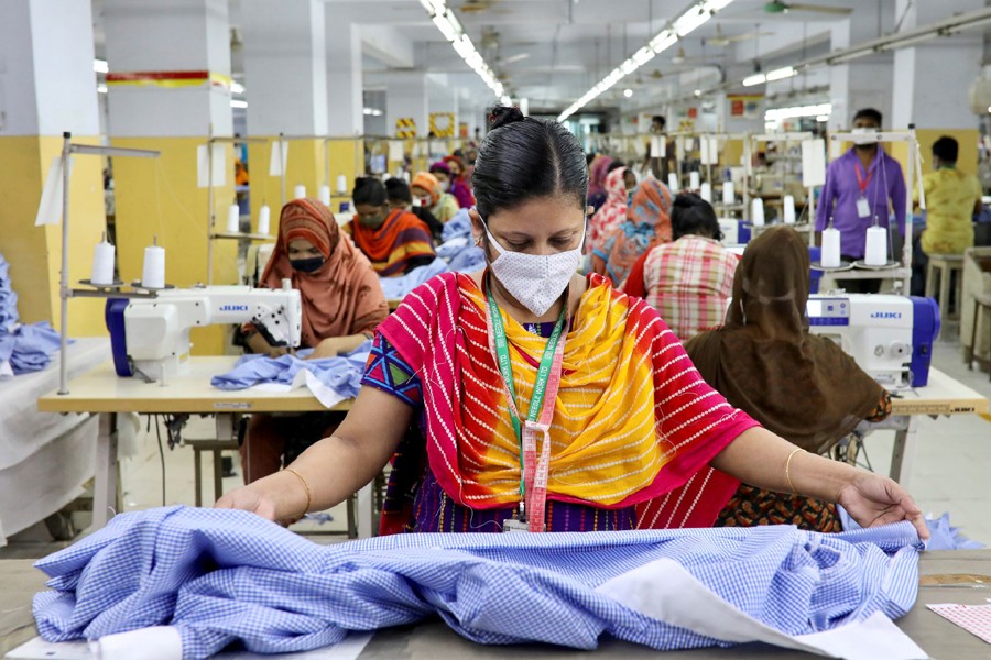 A woman works in a garment factory, as factories reopened after the government has eased the restrictions amid concerns over coronavirus disease (Covid-19) outbreak in Dhaka, Bangladesh on May 3, 2020 — Reuters/Files
