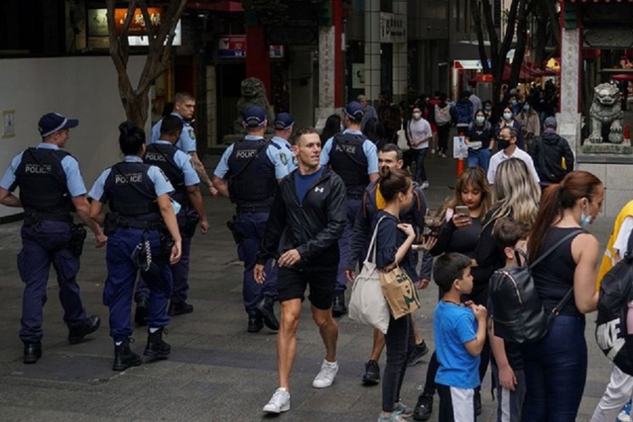 Police officers patrol through the city centre, as COVID-19 vaccination rates continue to rise, in Sydney, Australia, Nov 19, 2021