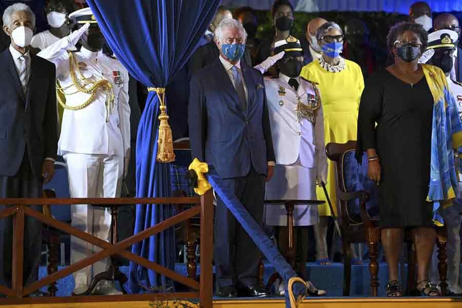Britain's Prince Charles, centre, stands with Barbados Prime Minister Mia Mottley, right, and former cricketer Garfield Sobers, left, during the Presidential Inauguration Ceremony for Dame Sandra Mason, at Heroes Square, in Bridgetown of Barbados on Tuesday –Reuters photo