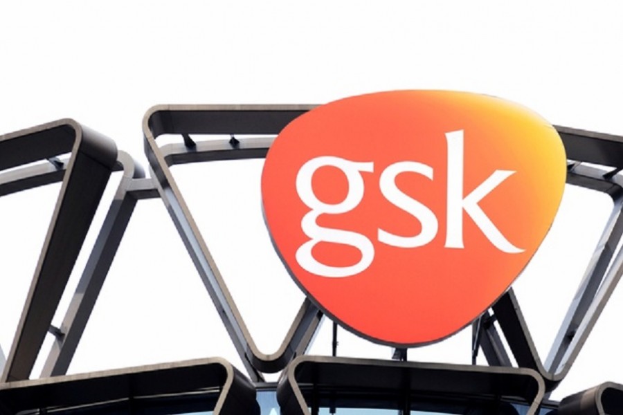 The GlaxoSmithKline (GSK) logo is seen on top of GSK Asia House in Singapore, March 21, 2018. Picture taken March 21, 2018. REUTERS/Loriene Perera