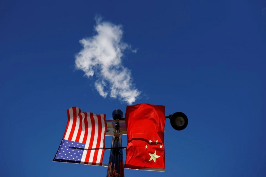 The flags of the United States and China fly from a lamppost in the Chinatown neighbourhood of Boston, Massachusetts, US on November 1, 2021 — Reuters/Files